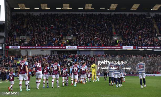 The players of Burnley and Queens Park Rangers walk out for the Sky Bet Championship between Burnley and Queens Park Rangers at Turf Moor on April...
