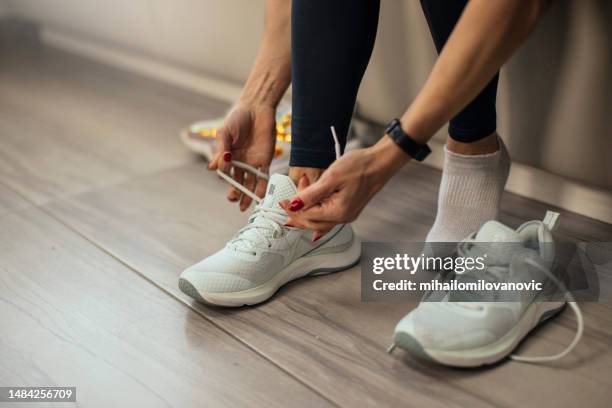 ties shoelaces - sneakers stock pictures, royalty-free photos & images