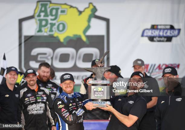 Jeb Burton, driver of the Solid Rock Carriers Chevrolet, and team owner Jordan Anderson celebrate in victory lane after winning the NASCAR Xfinity...