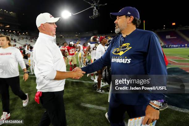 Head coach Skip Holtz of the Birmingham Stallions shakes hands with head coach Todd Haley of the Memphis Showboats after the game against the Memphis...