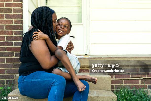 mom hugs her young affectionate son - indiana home stock pictures, royalty-free photos & images
