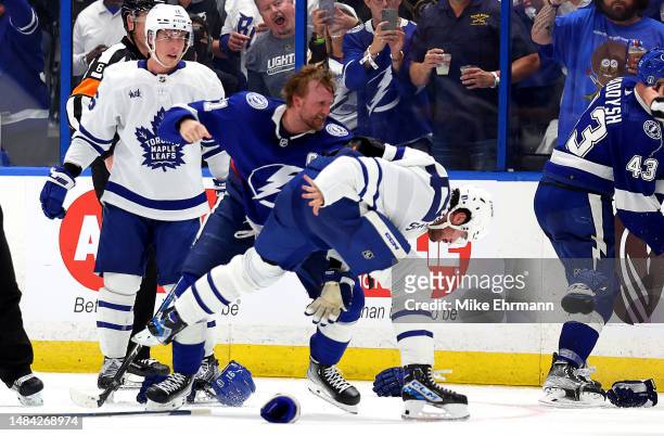 Steven Stamkos of the Tampa Bay Lightning and Auston Matthews of the Toronto Maple Leafs fight in the third period during Game Three of the First...
