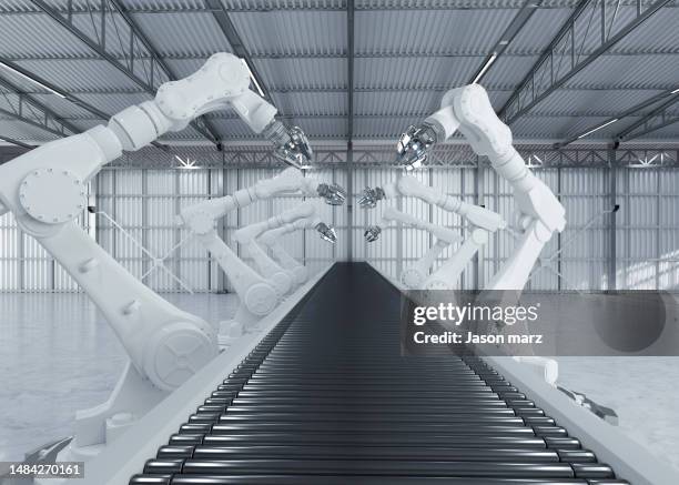 robotic arm in futuristic assembly manufacturing factory - smart factory stock pictures, royalty-free photos & images