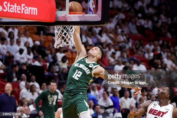 Grayson Allen of the Milwaukee Bucks dunks the ball during the third quarter against the Miami Heat during Game Three of the Eastern Conference First...