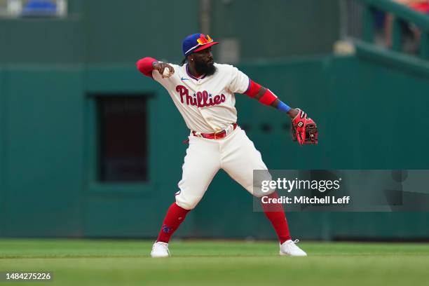 Josh Harrison of the Philadelphia Phillies throws the ball to first against the Colorado Rockies at Citizens Bank Park on April 22, 2023 in...