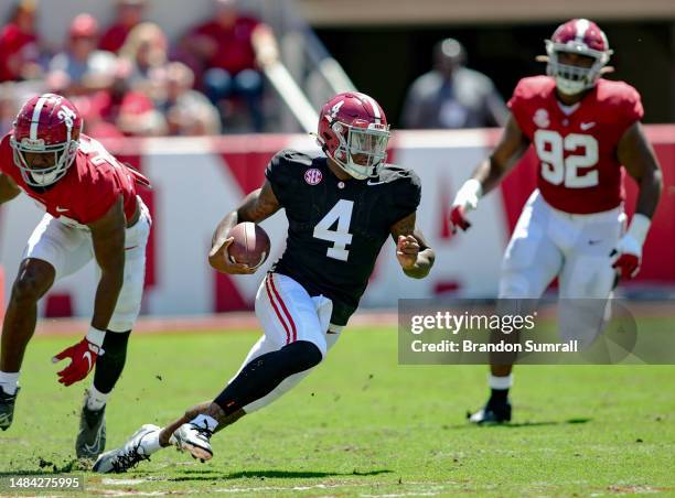 Jalen Milroe of the White Team runs the ball during the first half of the Alabama Spring Football Game at Bryant-Denny Stadium on April 22, 2023 in...