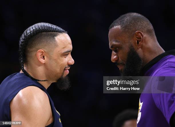 LeBron James of the Los Angeles Lakers talks with Dillon Brooks of the Memphis Grizzlies before Game Three of the Western Conference First Round...