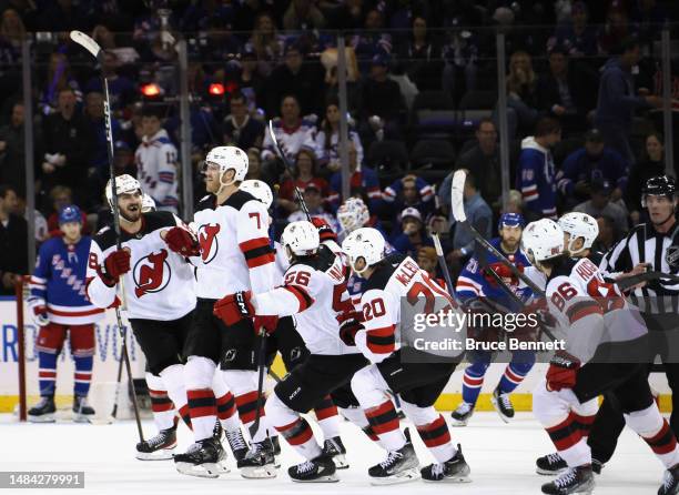 Dougie Hamilton of the New Jersey Devils celebrates his overtime goal against the New York Rangers during Game Three in the First Round of the 2023...