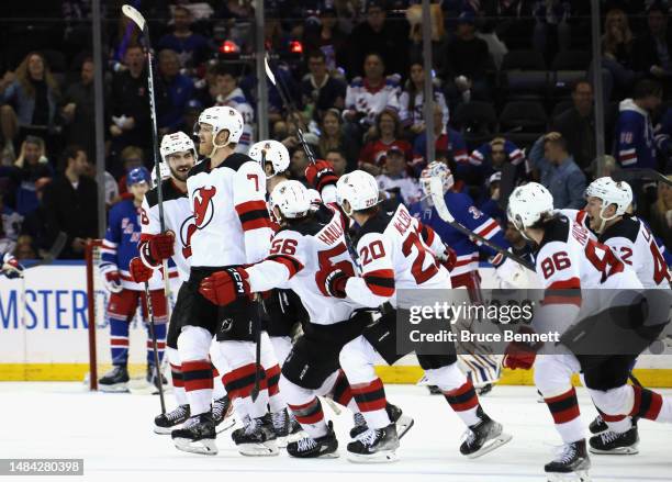 Dougie Hamilton of the New Jersey Devils celebrates his overtime goal against the New York Rangers during Game Three in the First Round of the 2023...