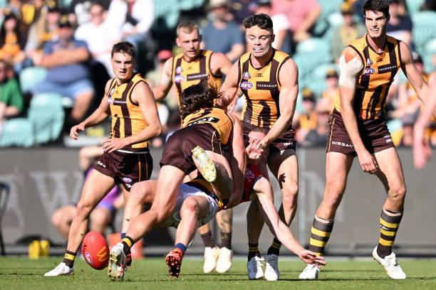 Rory Laird of the Crows is tackled by Jai Newcombe of the Hawks during the round six AFL match between Hawthorn Hawks and Adelaide Crows at...