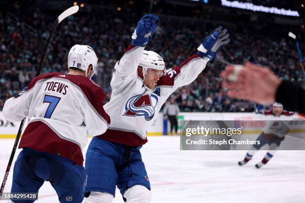 Devon Toews celebrates a goal by Mikko Rantanen of the Colorado Avalanche against the Seattle Kraken during the third period in Game Three of the...