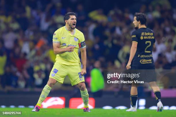 Henry Martin of America celebrates after scoring the team's first goal during the 16th round match between America and Pumas UNAM as part of the...