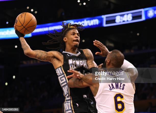 Ja Morant of the Memphis Grizzlies drives to the basket on LeBron James of the Los Angeles Lakers during 111-101 Lakers win in Game Three of the...