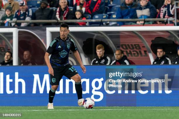 Roger Espinoza of Sporting Kansas City looks to pass during a game between Sporting Kansas City and New England Revolution at Gillette Stadium on...