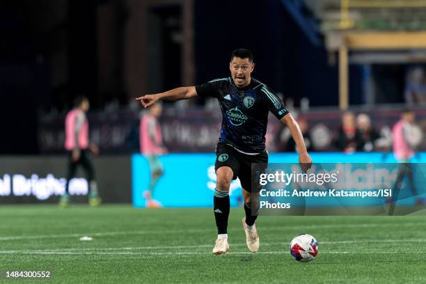 Roger Espinoza of Sporting Kansas City looks to pass during a game between Sporting Kansas City and New England Revolution at Gillette Stadium on...