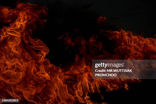 fire on a black background. - hell stock pictures, royalty-free photos & images