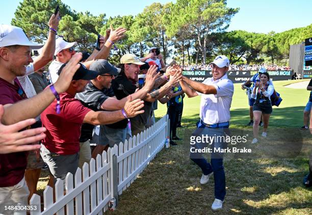 Chase Koepka of the Smash celebrates his hole in one with the crowd on the 12th hole during day three of Liv Golf Adelaide at The Grange Golf Course...