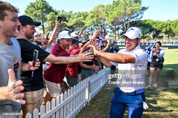 Chase Koepka of the Smash celebrates his hole in one with the crowd on the 12th hole during day three of Liv Golf Adelaide at The Grange Golf Course...