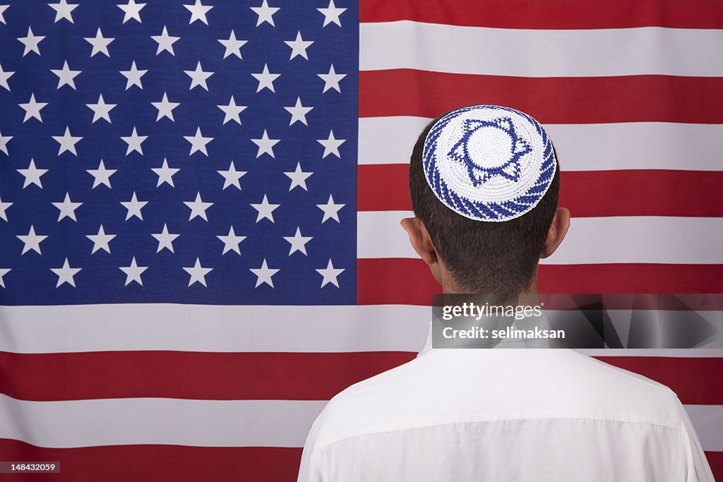 Jewish Citizen Wearing Yarmulke In Front Of American Flag