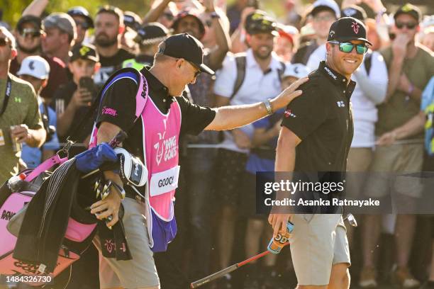 Talor Gooch of RangeGoats GC and his caddie Malcolm Baker walk onto the final hole during day three of Liv Golf Adelaide at The Grange Golf Course on...