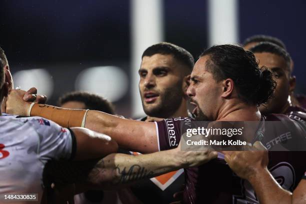 Josh Aloiai of the Sea Eagles scuffles with John Bateman of the Wests Tigers during the round eight NRL match between Wests Tigers and Manly Sea...