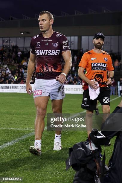 Tom Trbojevic of the Sea Eagles leaves the field with the trainer during the round eight NRL match between Wests Tigers and Manly Sea Eagles at...