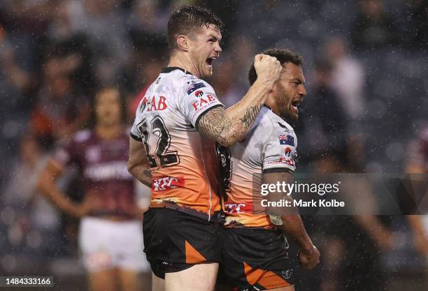 John Bateman and Apisai Koroisau of the Wests Tigers celebrate Apisai Koroisau of the Wests Tigers scoring a try during the round eight NRL match...