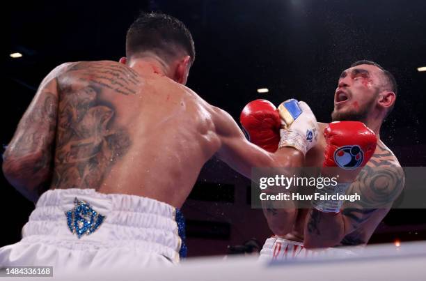 Joe Cordina ipunches Shavkatdzhon Rakhimov during the IBF World Super Feather weight title at the Motorpoint Arena Cardiff on April 22, 2023 in...