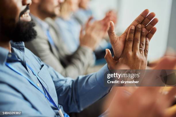 applauding on successful business seminar! - applauding stock pictures, royalty-free photos & images