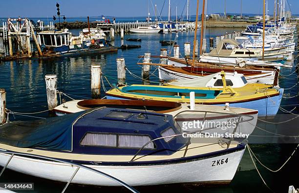 overhead of boats moored at marina. - porto turistico foto e immagini stock