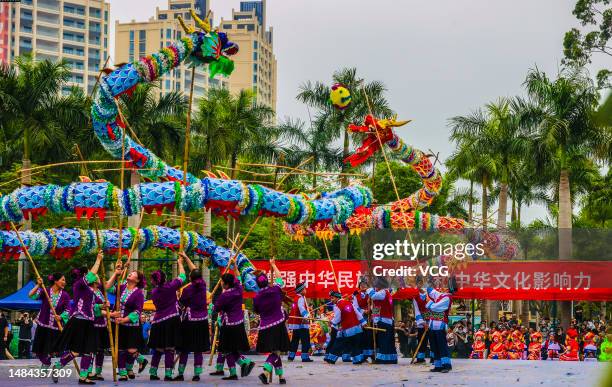 People perform during Qingxiu International Tournament of Traditional Dragon Dance to celebrate Sanyuesan Festival on April 22, 2023 in Nanning,...