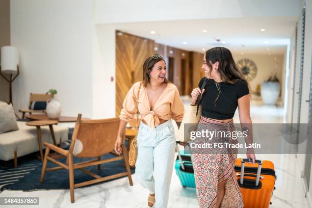 traveler friends arriving at a hotel with their luggage - girlfriend leaving stock pictures, royalty-free photos & images