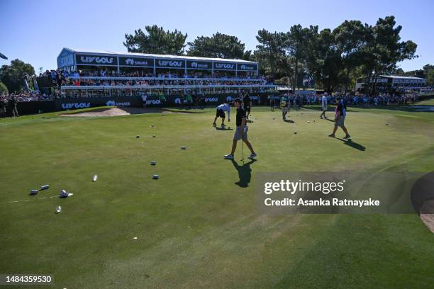 General view of on the 12th hole green with plastics cups and beer cans thrown onto the hole after Pat Perez of 4Aces GC made a birdie on the 12th...