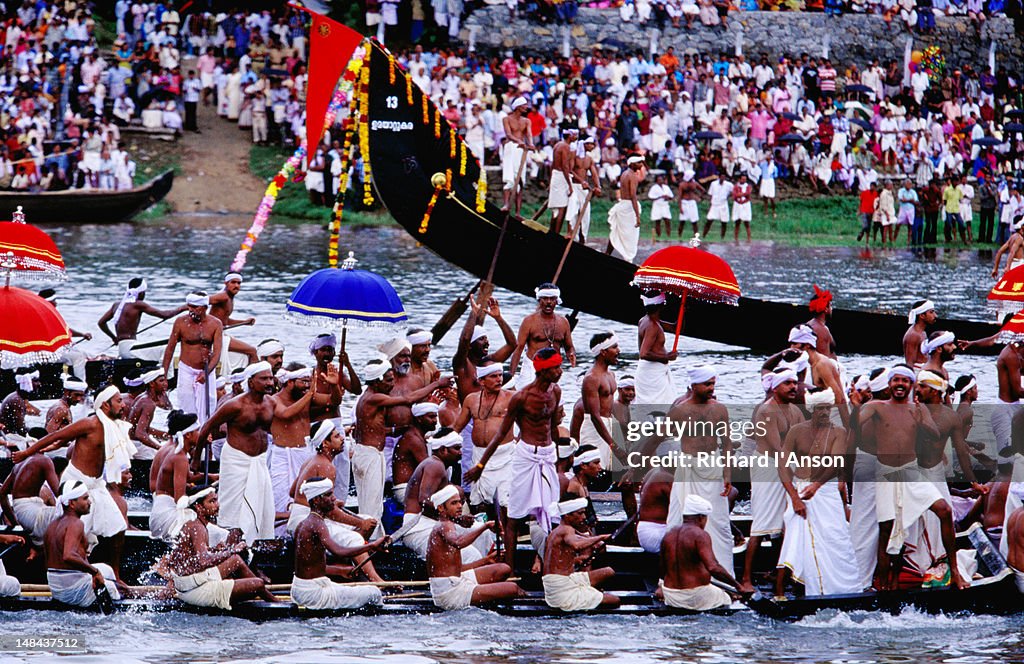 Snake boats in pre-race procession on Pampa River River during Onam festival Celebrations.