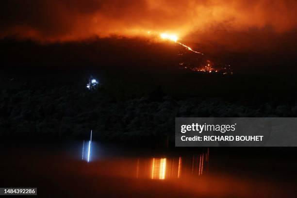 This picture taken on July 3, 2023 shows the eruption of the Piton de la Fournaise volcano on the La Reunion island.