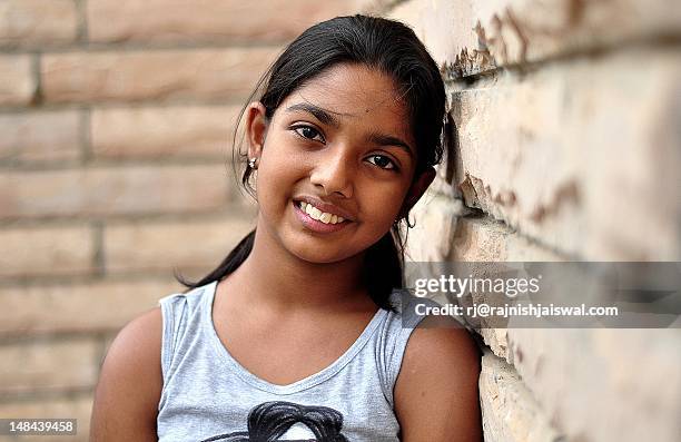 girl leaning on t wall - 11 year old indian girl stock pictures, royalty-free photos & images
