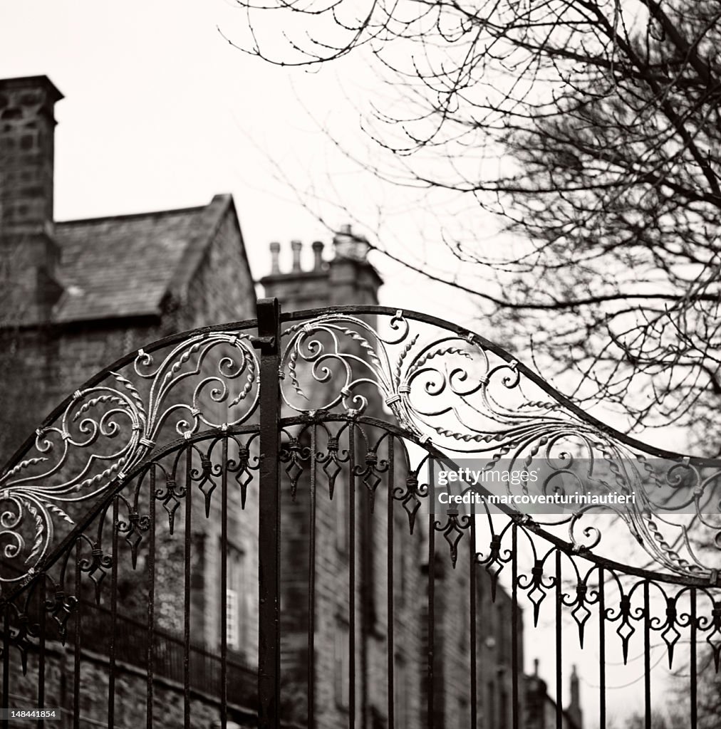Old gate, Durham - Traditional Anglosaxon gate, closed, with mansion