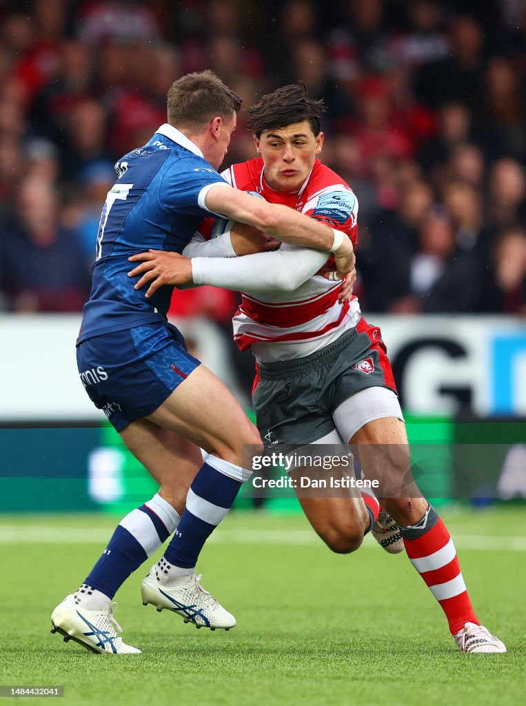 George Slicker Rugby Louis Rees-Zammit of Gloucester Rugby is tackled by George Ford of ...
