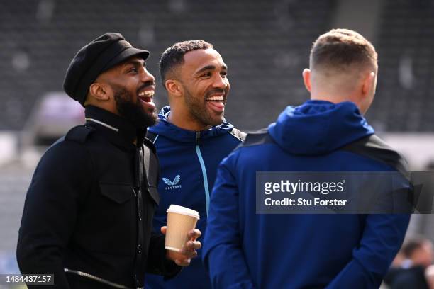 Former Tottenham Hotspur player Danny Rose and Callum Wilson of Newcastle United react prior to the Premier League match between Newcastle United and...