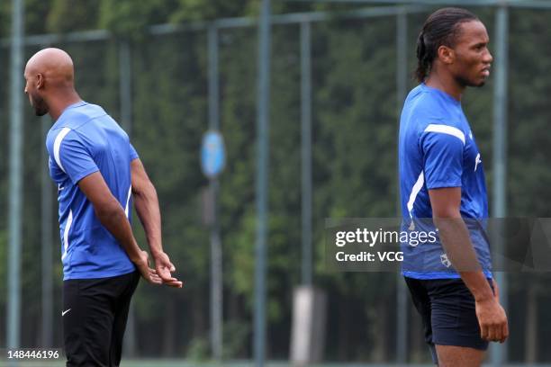 Shanghai Shenhua players Didier Drogba and Nicolas Anelka are seen during a training session at Kangqiao Training Base on July 16, 2012 in Shanghai,...