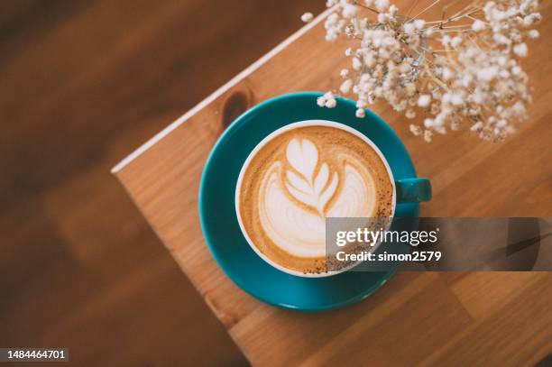 a taste of beauty: a delightful cappuccino with an exquisite latte design - cappuccino imagens e fotografias de stock