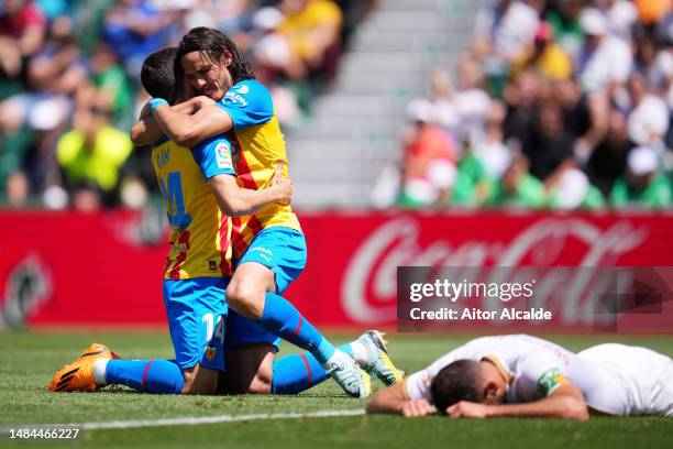 Jose Luis Gaya and Edinson Cavani of Valencia CF celebrate their sides second goal, an own goal by Gonzalo Verdu of Elche CF during the LaLiga...