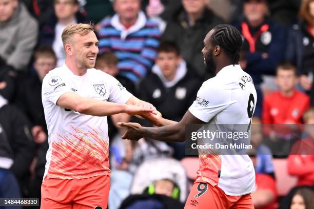 Michail Antonio of West Ham United celebrates with teammate Jarrod Bowen after scoring the team's first goal during the Premier League match between...