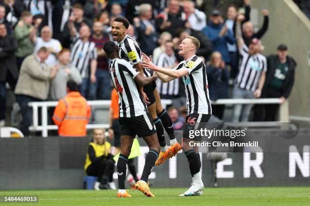 Jacob Murphy of Newcastle United celebrates with teammates after scoring the team's third goal during the Premier League match between Newcastle...