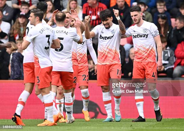 Lucas Paqueta of West Ham United celebrates with teammates after scoring the team's second goal during the Premier League match between AFC...