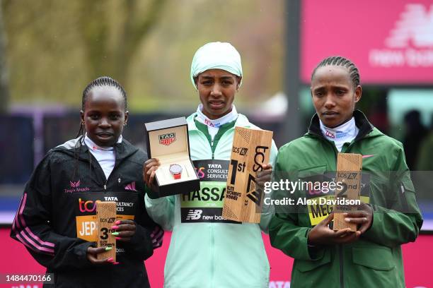 Third place finisher Peres Jepchirchir of Kenya, first place finisher Sifan Hassan of Netherlands and second place finisher Alemu Megertu of Ethiopia...