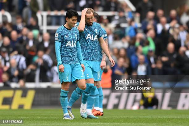 Son Heung-Min and Harry Kane of Tottenham Hotspur react after Newcastle United scored their sides fourth goal during the Premier League match between...