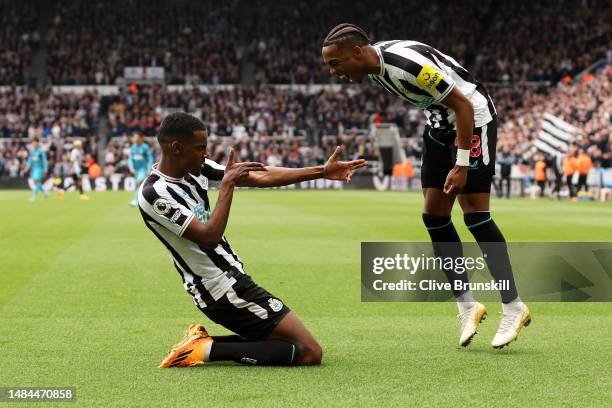 Alexander Isak of Newcastle United celebrates with teammate Joe Willock after scoring the team's fourth goal during the Premier League match between...