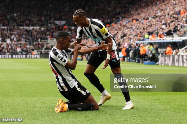 Alexander Isak of Newcastle United celebrates with teammate Joe Willock after scoring the team's fourth goal during the Premier League match between...