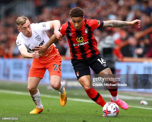 Jarrod Bowen of West Ham United battles for possession with Marcus Tavernier of AFC Bournemouth during the Premier League match between AFC...